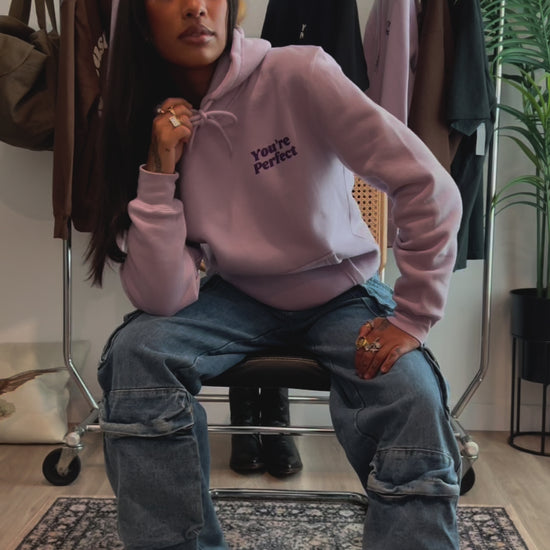 Lilac hoodie on model wearing size small