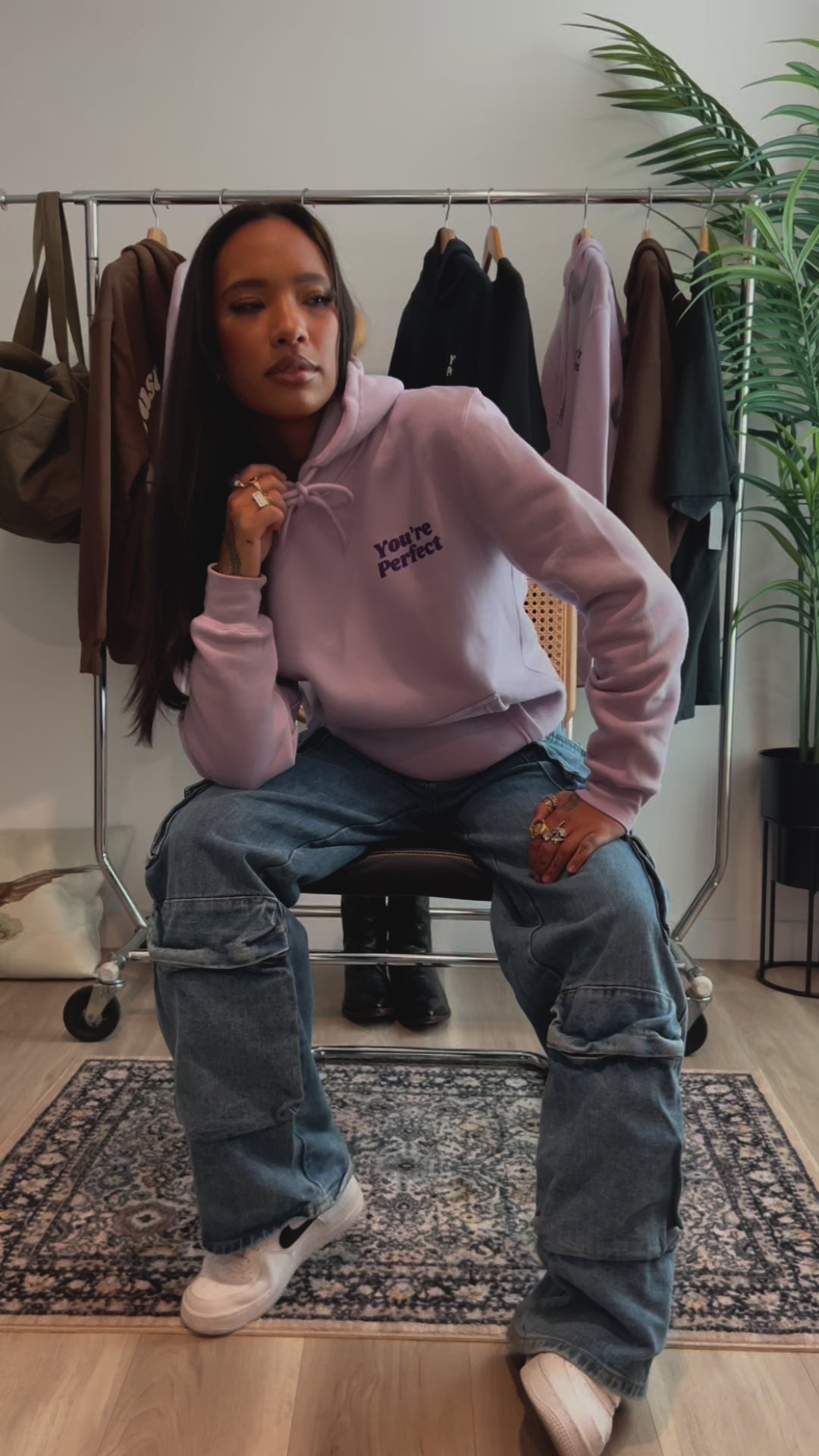 Lilac hoodie on model wearing size small